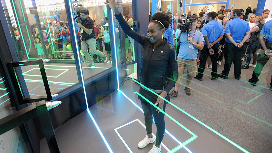 A woman playing air tennis — part of an American Express experiential marketing campaign. 
